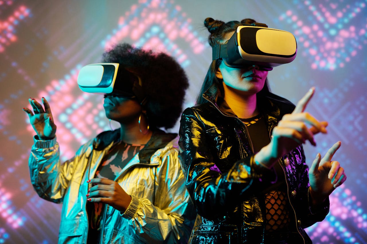 Two young women immersed in a futuristic virtual reality experience, showcasing vibrant technology.
